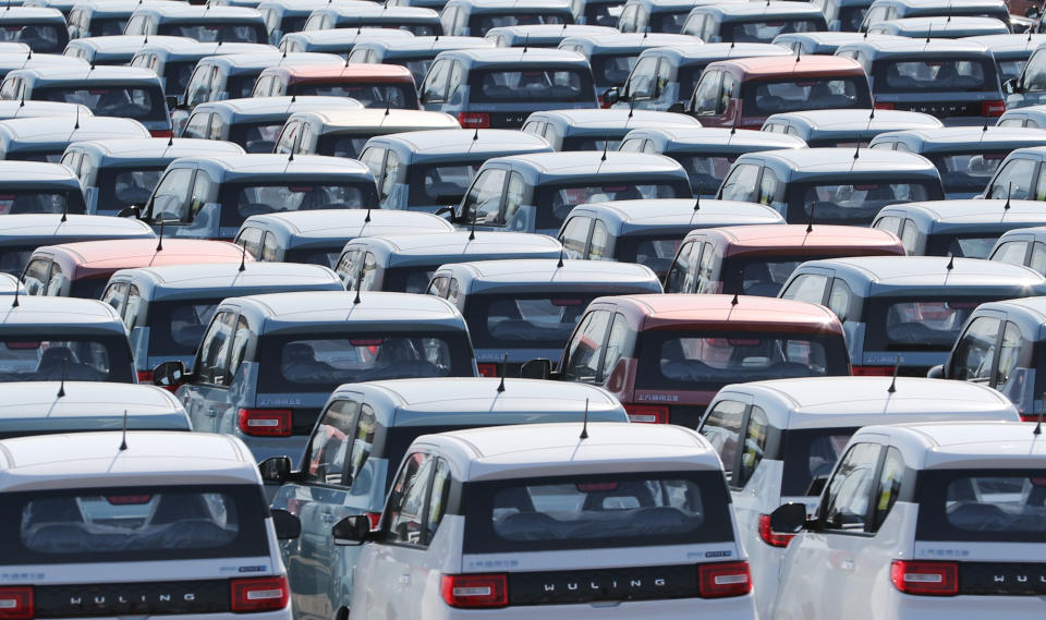 QINGDAO, CHINA - FEBRUARY 17, 2021 - New energy vehicles, which have just rolled off the production line of SAIC-GM-Wuling Qingdao Branch, are neatly placed in a parking lot in Qingdao, Shandong Province, China, February 17, 2021.- PHOTOGRAPH BY Costfoto / Barcroft Studios / Future Publishing (Photo credit should read Costfoto/Barcroft Media via Getty Images)