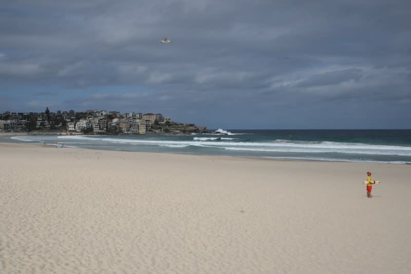 Surf rescue personnel enforce a closure of Bondi Beach to prevent the spread of the coronavirus disease (COVID-19) in Sydney