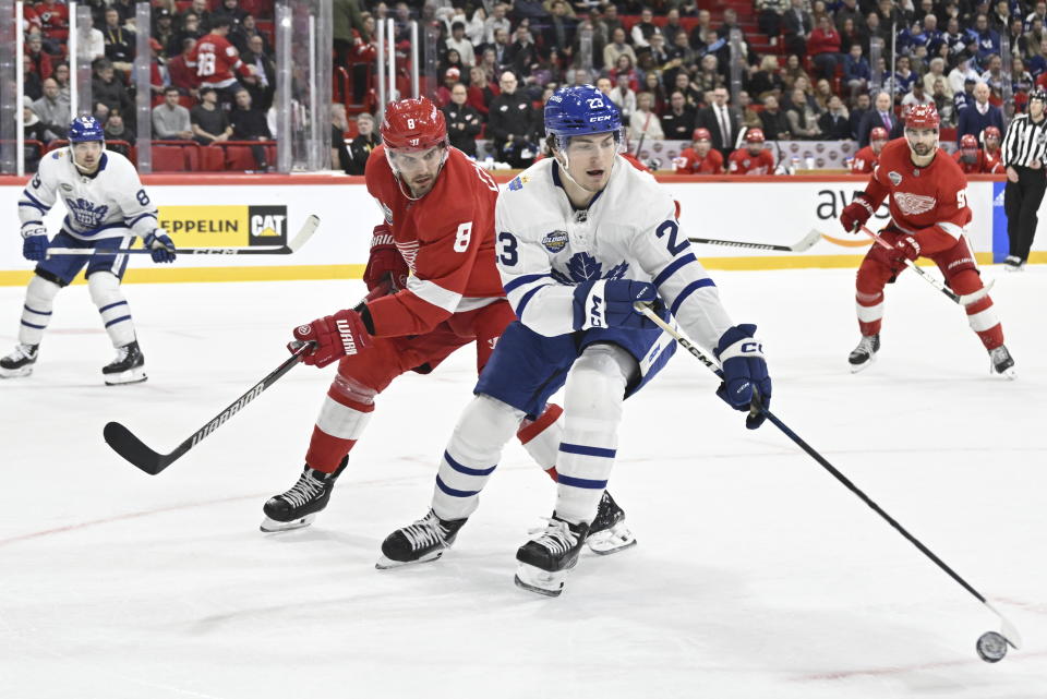 Detroit's Ben Chiarot, left, and Toronto's Matthew Knies in action during the NHL Global Series Sweden ice hockey match between Toronto Maple Leafs and Detroit Red Wings and at Avicii Arena in Stockholm, Sweden, Friday Nov. 17, 2023. (Henrik Montgomery/TT News Agency via AP)
