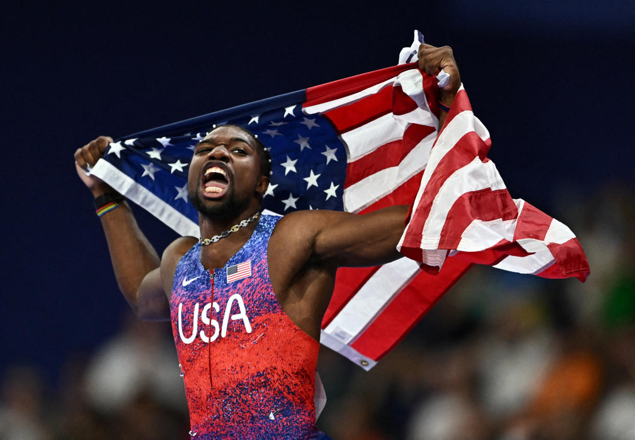 Noah Lyles, of the United States, celebrates after winning gold at the men's 100-meter final in France on Sunday.  