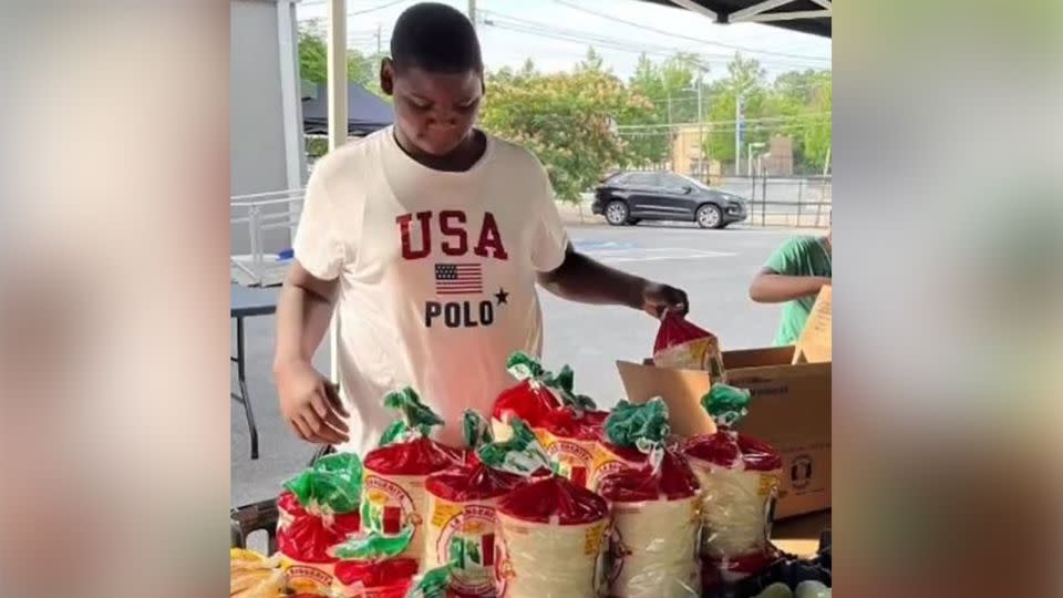 Deshon DuBose volunteers at a food drive. He enjoyed helping people who were less fortunate, his mother said.  - Courtesy Charlett and Maya DuBose