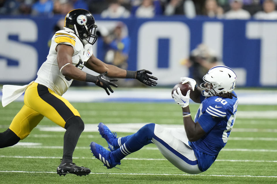 Indianapolis Colts' Jelani Woods (80) is tackled by Pittsburgh Steelers' Myles Jack (51) during the second half of an NFL football game, Monday, Nov. 28, 2022, in Indianapolis. (AP Photo/AJ Mast)