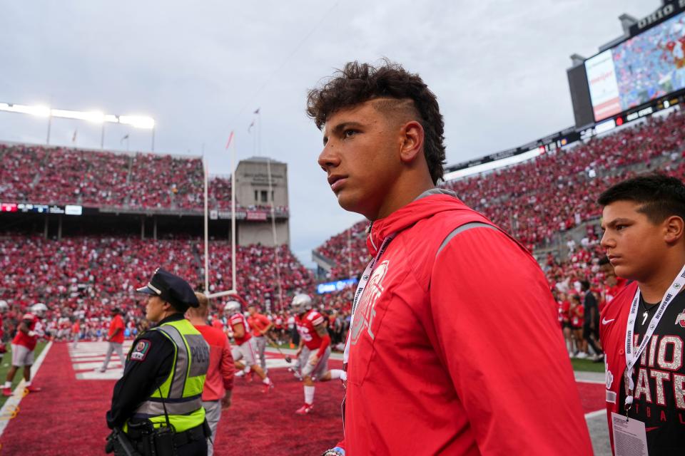 Sep 3, 2022; Columbus, Ohio, USA;  Quarterback recruit Dylan Raiola walks the sideline prior to the NCAA football game between the Ohio State Buckeyes and Notre Dame Fighting Irish at Ohio Stadium. Mandatory Credit: Adam Cairns-USA TODAY Sports