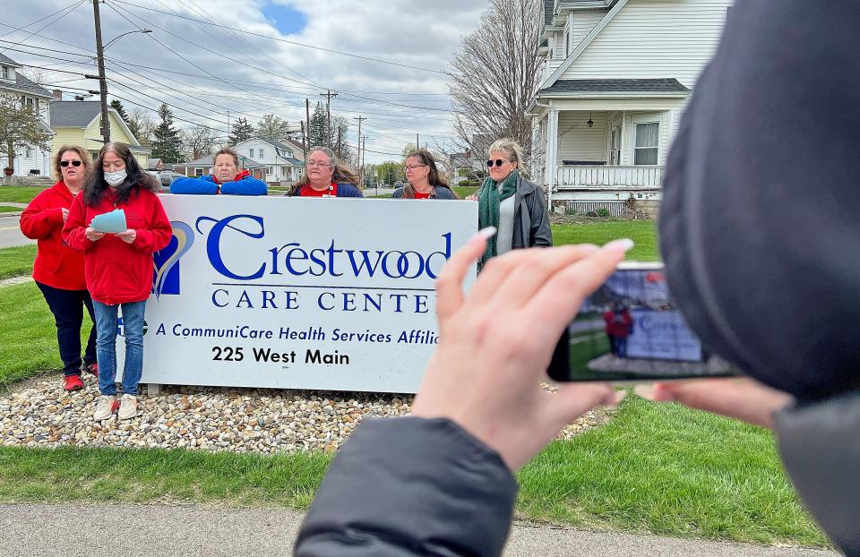 Terri Risner, STNA at Crestwood Care Center, reads a statement Tuesday afternoon outside the facility in Shelby.