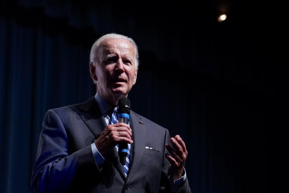 President Joe Biden speaks to a crowd in a overflow room at a rally hosted by the Democratic National Committee at Richard Montgomery High School, Thursday, Aug. 25, 2022, in Rockville, Md. (AP Photo/Evan Vucci)