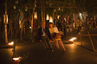 <p>A couple enjoy a swing as installations are lit in front of Tate Modern as part of the ‘Fire Garden’ event by Compagnie Carabosse in London, England. The event forms part of the 'London’s Burning’ festival which commemorates the Great Fire of London. (Dan Kitwood/Getty Images)<br></p>