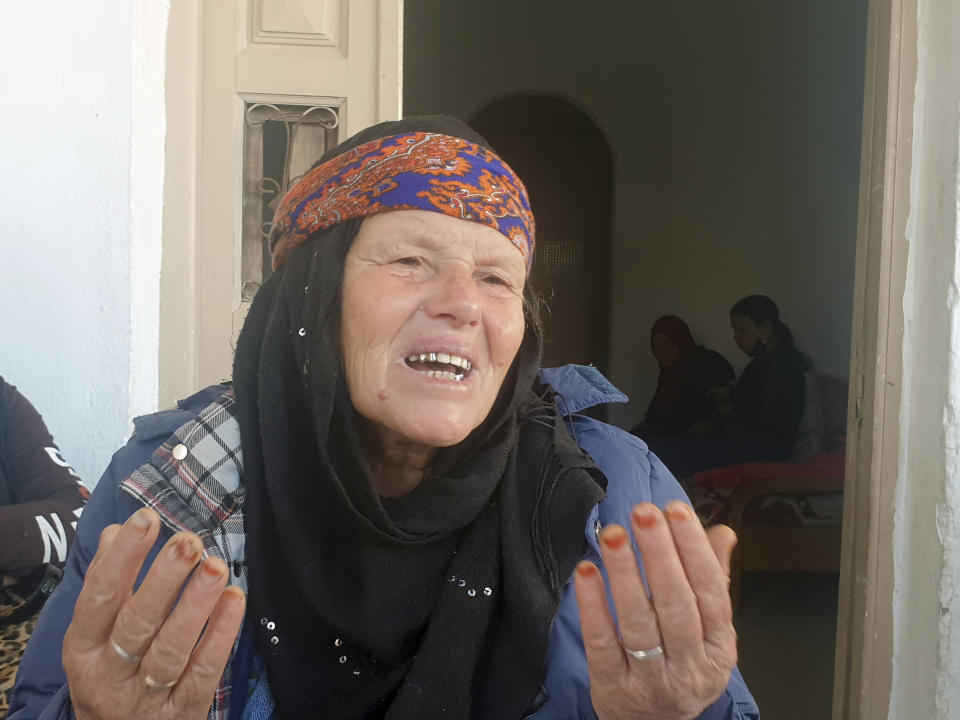 Gamra, the mother of the Nice attacker Ibrahim Issaoui gestures as she adresses reporters in Sfax, Tunisia, Friday, Oct. 30, 2020. The family of Ibrahim Issaoui expressed shock after he attacked a church in Nice and killed three people in what French and Tunisian authorities are investigating as a terrorist attack. Tunisian prosecutors say he had not been on their radar for radicalization before he fled with other migrants to the Italian island of Lampedusa in September, eventually making his way to Nice. (AP Photo/Mehdi El Arem)