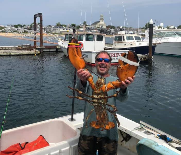 Michael Packard poses with a lobster, not a whale.