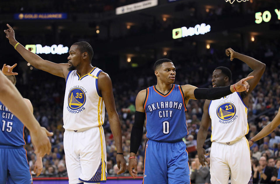 Kevin Durant and Russell Westbrook do their best not to talk. (Getty Images)