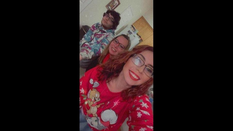 Kylie Douglas poses for a photo just before Christmas 2021 with her mother, Kacy Joel, and brother, Devin Nicolas Joel. Kacy Joel was killed Tuesday, and Devin Joel has been arrested in her death.