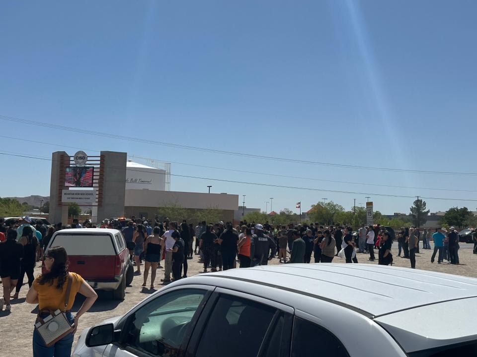 Parents waited for students being released Mountain View High School after a threat in the area. The students were bused to a reunification area at Greg and Mark Jason drives Friday, April 16.