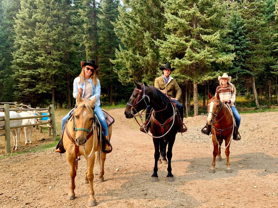 the writer in montana riding horses with friends