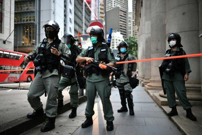 Riot police officers stand guard ahead of a pro-democracy march in Hong Kong a year after pro-democracy protests erupted following opposition to a bill allowing extraditions to mainland China (AFP Photo/Anthony WALLACE)