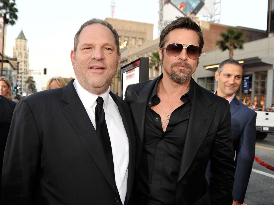 Harvey Weinstein and Brad Pitt pose together at the premiere of "Inglourious Basterds" in 2009.