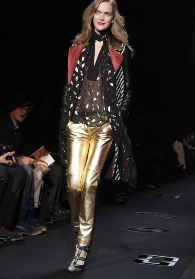 <b>Diane Von Furstenburg AW 13 runway show<br><br></b>Gold trousers, sheer blouses and metallic accents were key parts of the DVF show.<br><br>©Rex<b><br></b>