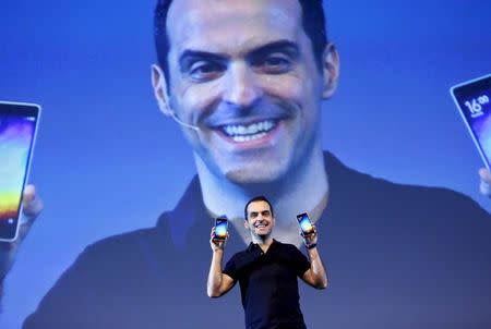 Xiaomi's vice president of international operations, Hugo Barra displays the "Mi 4i" phones during its launch in New Delhi April 23, 2015. REUTERS/Anindito Mukherjee