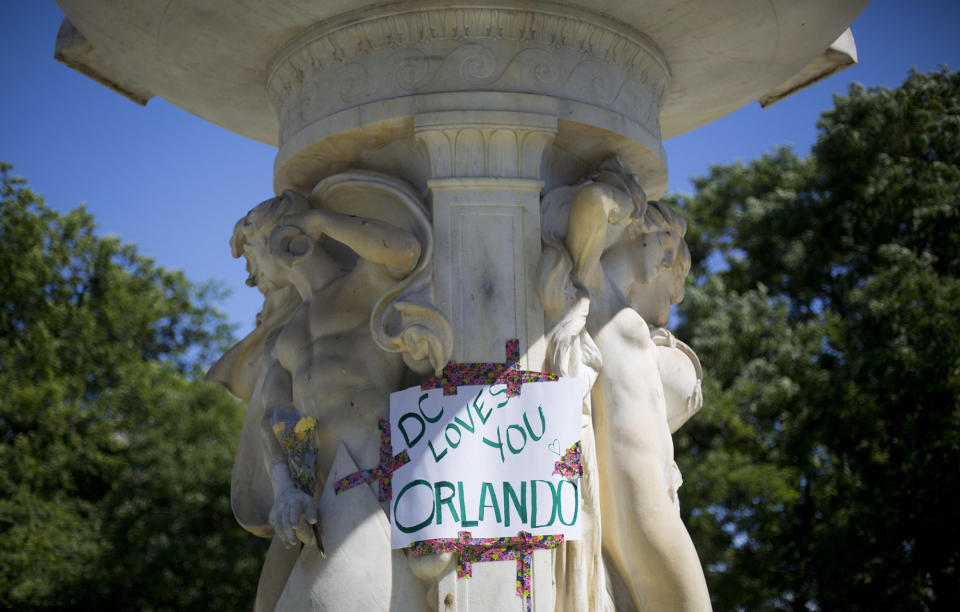 <p>A sign is posted on the fountain at Dupont Circle in support of the victims of the massacre at a Orlando nightclub, after LGBT pride festival organizers held a moment of silence for shooting victims, June 12, 2016 in Washington. (AP Photo/Pablo Martinez Monsivais) </p>