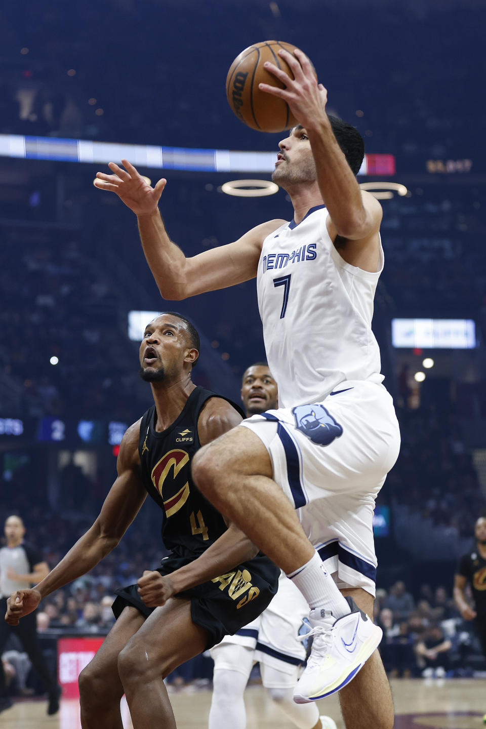 Memphis Grizzlies forward Santi Aldama (7) shoots ahead of Cleveland Cavaliers forward Evan Mobley (4) during the first half of an NBA basketball game, Thursday, Feb. 2, 2023, in Cleveland. (AP Photo/Ron Schwane)