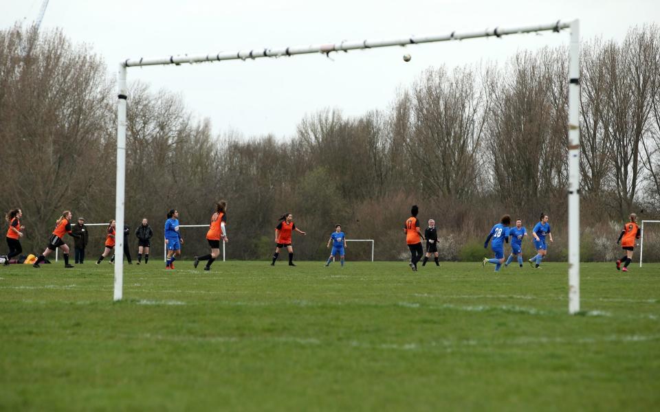 A girls football match on Hackney Marshes in London following Friday's announcement that the Premier League has suspended all matches until Saturday April 4, 2020. PA Photo. Picture date: Sunday March 15, 2020 - PA /Steven Paston 