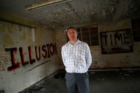 Chairman and founder of Bletchley Park Capital Partners Ltd Tim Reynolds poses in G-block where the National College of Cyber Education will be based at Bletchley Park in Milton Keynes, Britain, September 15, 2016. Picture taken September 15, 2016. REUTERS/Darren Staples