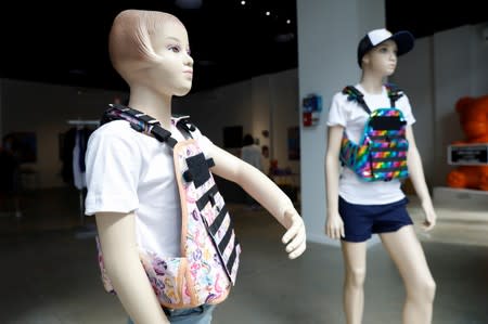 Mannequins wearing a bullet proof vests are seen as part of an art installation by artist WhIsBe titled "Back to School Shopping" to illustrate the dangers of gun violence in schools, at a gallery in New York City