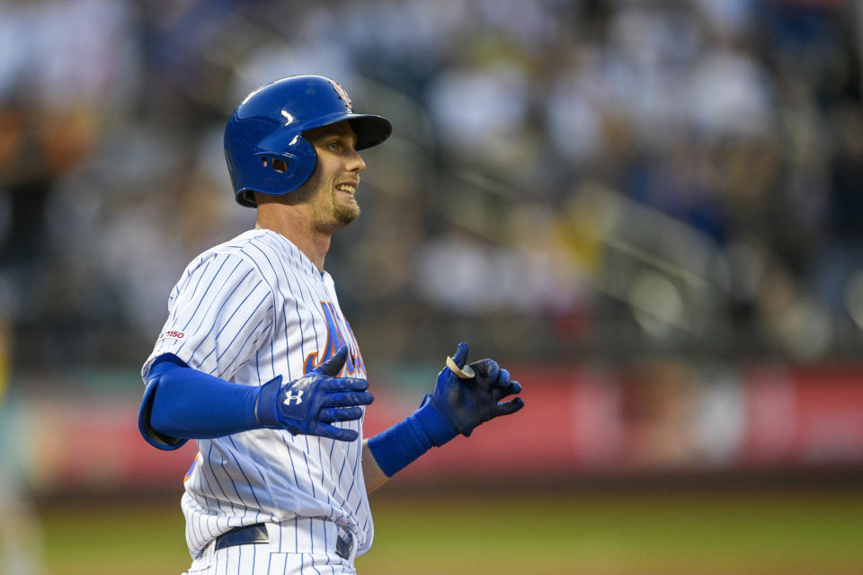 New York Mets' Jeff McNeil rounds first base after hitting a three-run home run, also scoring Amed Rosario and Zack Wheeler, during the third inning of a baseball game against the Pittsburgh Pirates, Friday, July 26, 2019, in New York. (AP Photo/Corey Sipkin)