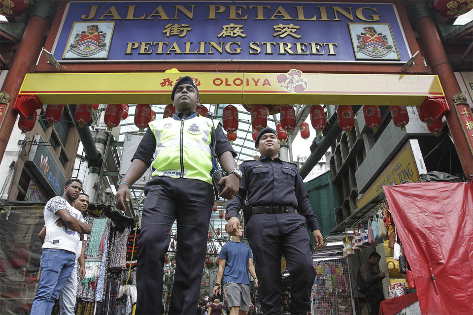 Police officers are seen patrolling Petaling Street in Kuala Lumpur, September 17, 2015. — Picture by Yusof Mat Isa