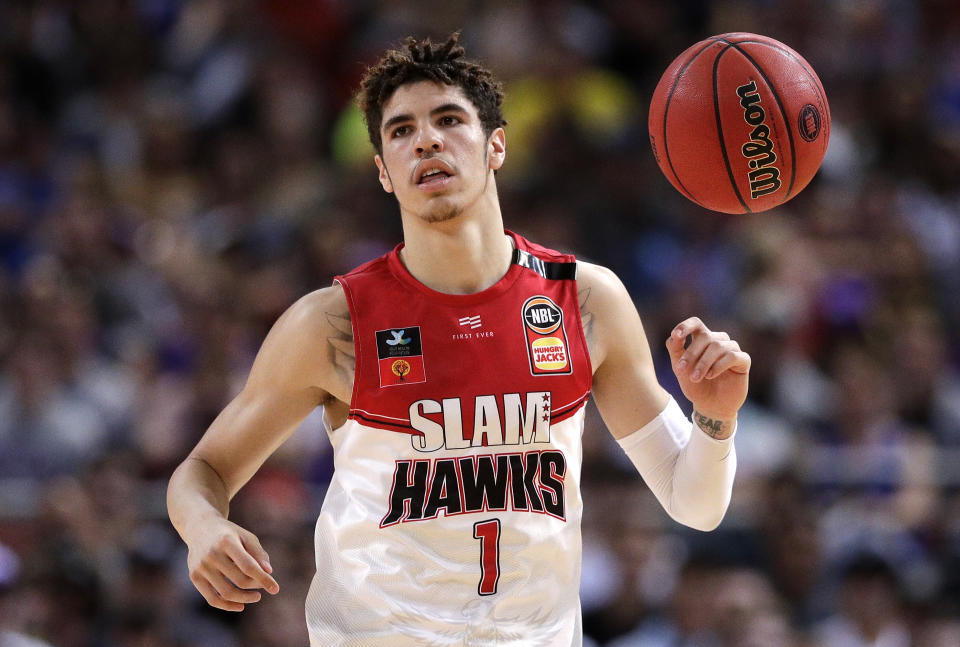 FILE - In this Nov. 17, 2019, file photo, LaMelo Ball of the Illawarra Hawks brings the ball up during a game against the Sydney Kings in the Australian Basketball League in Sydney. The Charlotte Hornets selected Ball in the NBA draft Wednesday, Nov. 18. (AP Photo/Rick Rycroft, File)