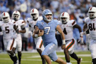 North Carolina quarterback Sam Howell (7) runs for a touchdown against Miami during the second half of an NCAA college football game in Chapel Hill, N.C., Saturday, Oct. 16, 2021. (AP Photo/Gerry Broome)