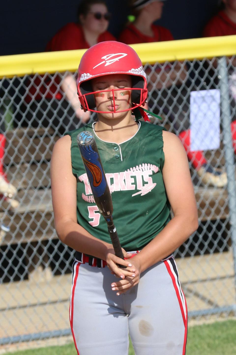 Oak Harbor's Porter Gregory gathers her thoughts before her at bat.