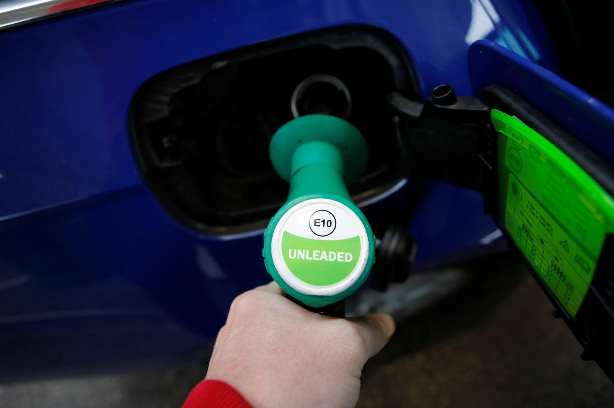 A motorist fills his car with the new E10 grade of unleaded petrol at a filling station in Liverpool, Britain, September 1, 2021. REUTERS/Phil Noble