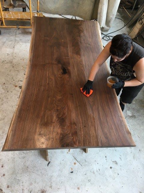 Amelia Christensen works on a wood piece in Brooklyn, New York.