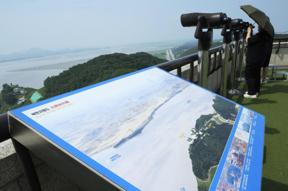 A visitor watches the North Korea side from the Unification Observation Post in Paju, South Korea, Thursday, July 20, 2023. North Korea wasn't responding Thursday to U.S. attempts to discuss the American soldier who bolted across the heavily armed border and whose prospects for a quick release are unclear at a time of high military tensions and inactive communication channels. (AP Photo/Ahn Young-joon)