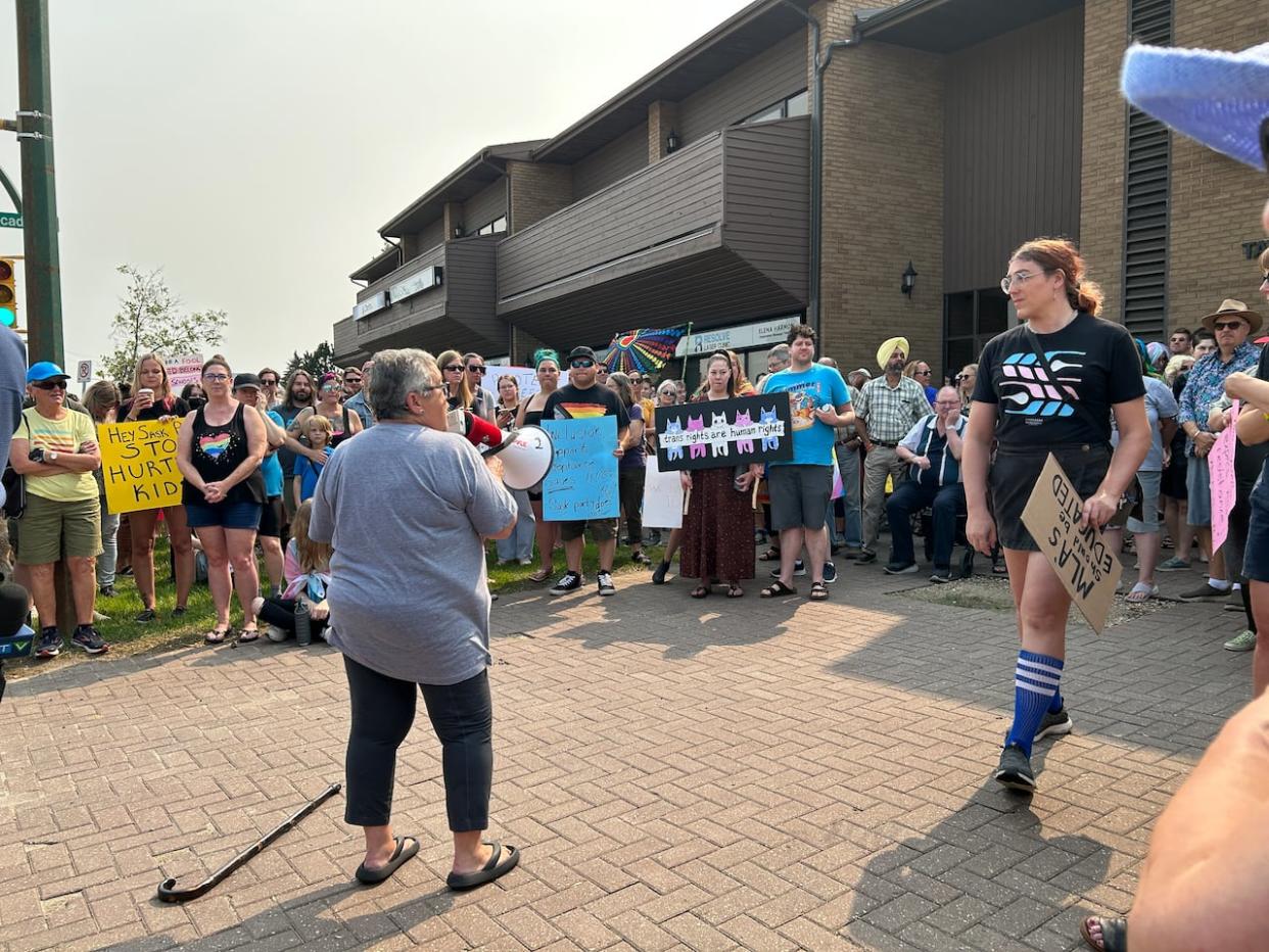 People rallied in Sasktoon Sunday against recently announced school policies around sexual education and students pronouns. (Camille Cusset/CBC - image credit)