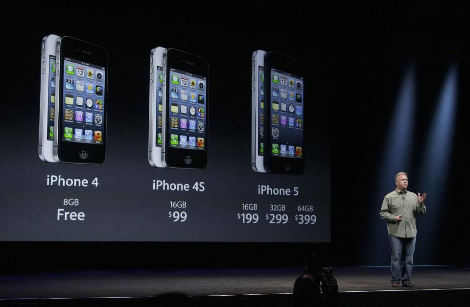 Phil Schiller, Apple's senior vice president of worldwide marketing, gives prices of the iPhone 5 during an Apple event in San Francisco, Wednesday, Sept. 12, 2012. (AP Photo/Jeff Chiu)