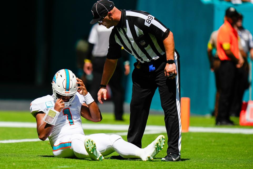 Tua Tagovailoa is slow to get up after a late hit by Bills linebacker Matt Milano.