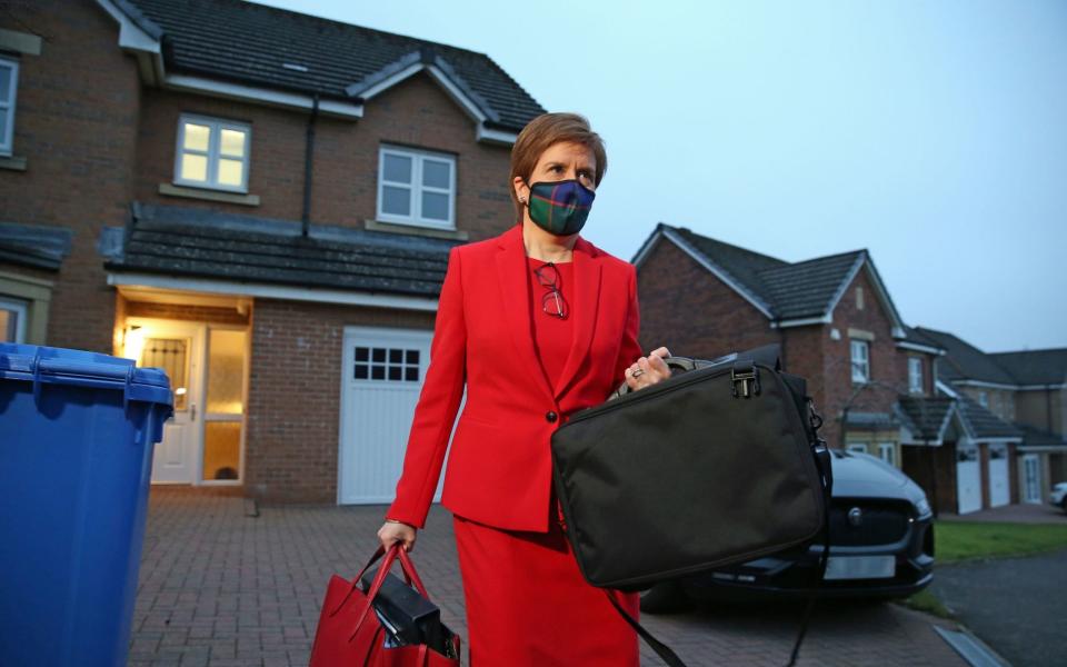 Nicola Sturgeon, leaves her home in Glasgow to head to Holyrood in Edinburgh to give evidence to the Scottish Parliament's inquiry into her government's unlawful investigation of the former First Minister Alex Salmond - PA