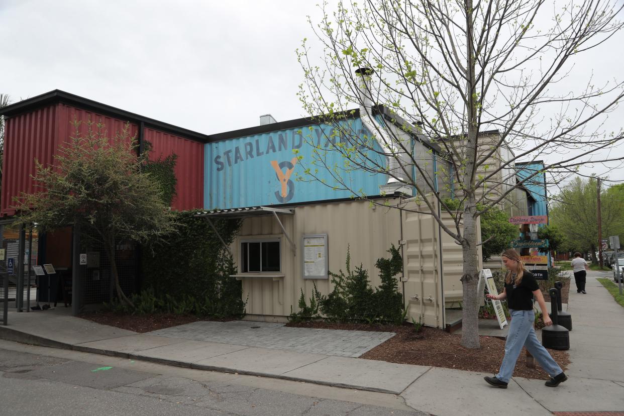 An employee walks toward the entrance to Starland Yard on DeSoto Avenue.