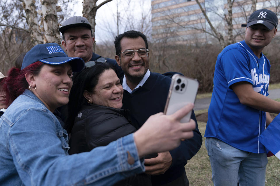 Nicaraguan opposition leader Felix Maradiaga poses for a selfie with supporters in Chantilly, Va., Thursday, Feb. 9, 2023. Maradiaga was among some 222 prisoners of the government of Nicaraguan President Daniel Ortega who arrived from Nicaragua to the Washington Dulles International Airport on Thursday, after an apparently negotiated release. (AP Photo/Jose Luis Magana)
