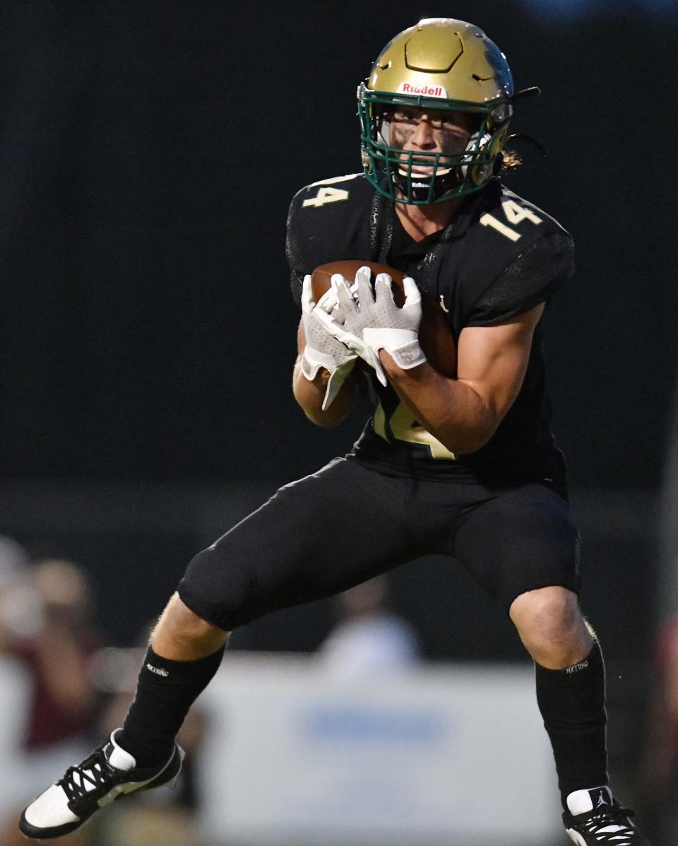 Nease receiver Maddox Spencer (14) pulls in a pass in the end zone for a touchdown against St. Augustine.