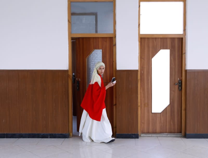 Mirzaie founder of a Sama Dance group, arrives before a dance session in Kabul