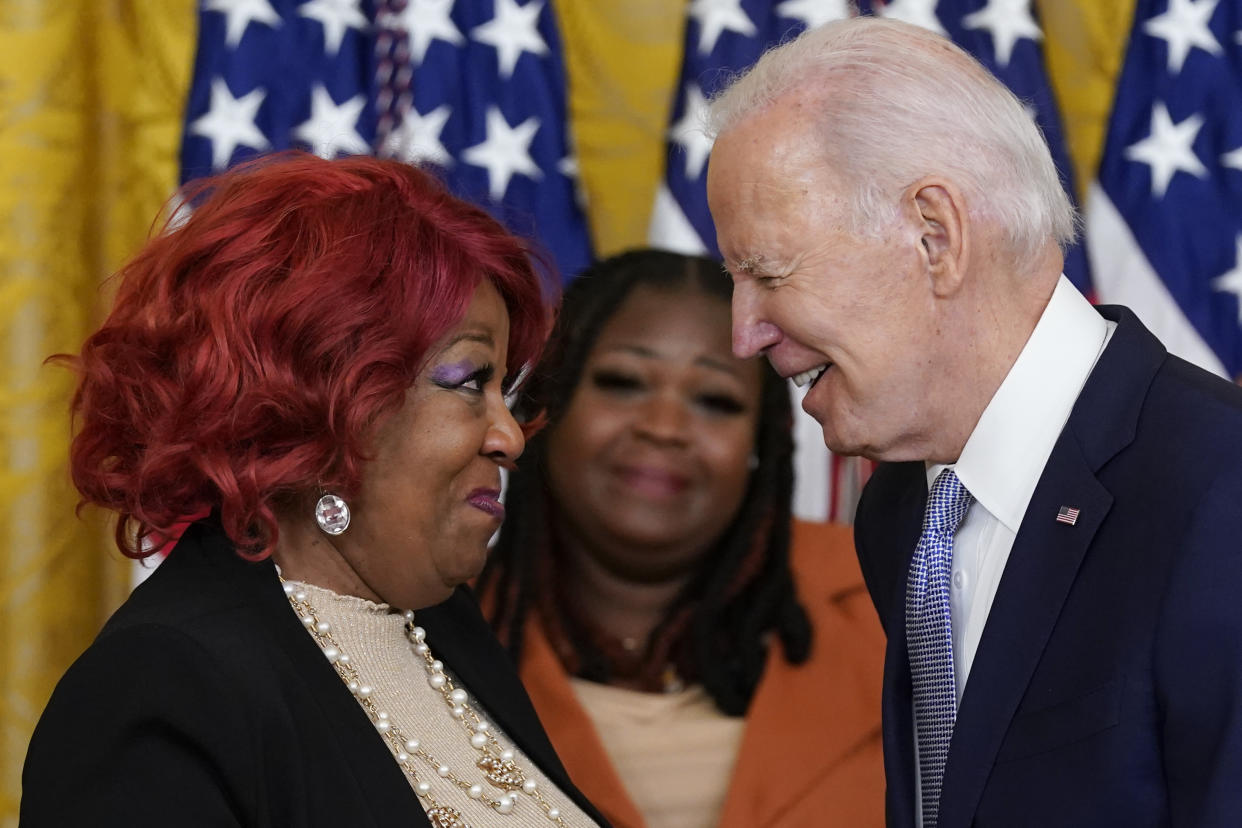 President Biden awards the Presidential Citizens Medal, the nation’s second-highest civilian honor, to Ruby Freeman as her daughter, Wandrea “Shaye” Moss, looks on. 