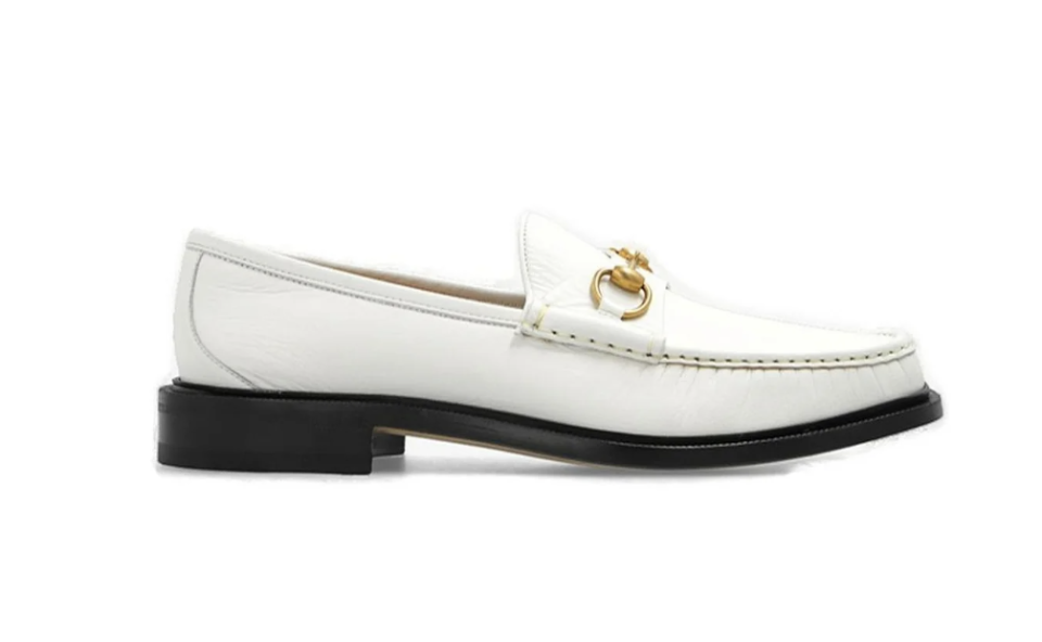 A close-up of the white Gucci Horsebit Loafers