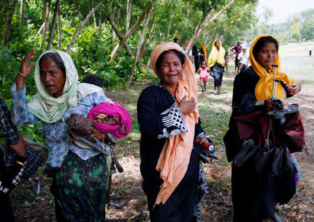 Rohingya women cry after being restricted by members of Border Guards Bangladesh (BGB) to further enter into Bangladesh, in Cox’s Bazar, Bangladesh August 28, 2017. REUTERS/Mohammad Ponir Hossain