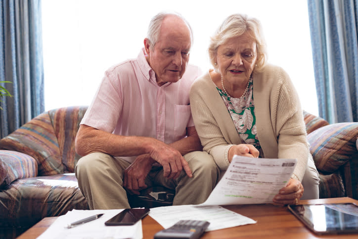 A man and his wife go over his options for an IRA he is inheriting from his sister. 