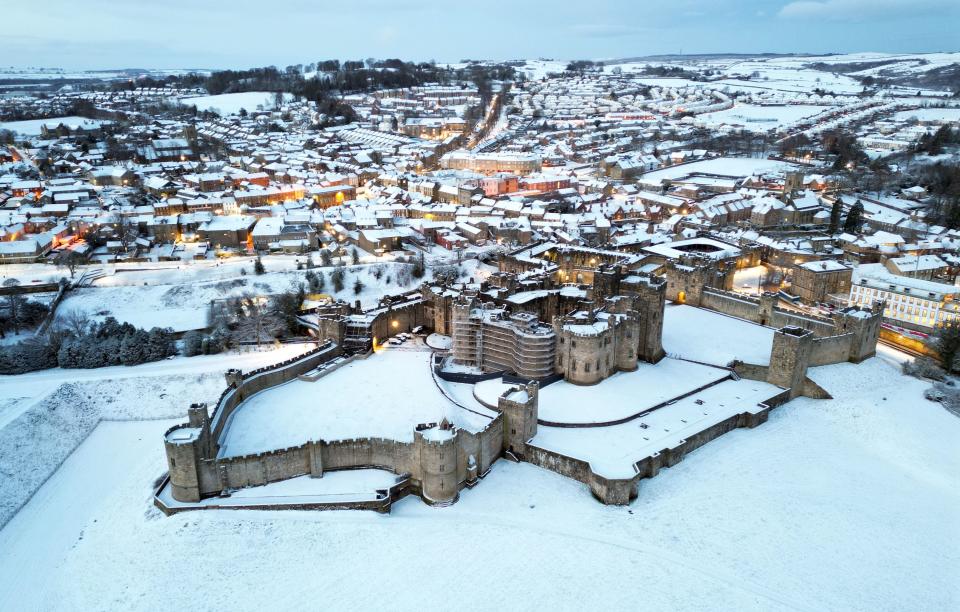 Snow covered fields surround Alnwick Castle in Northumberland (PA)