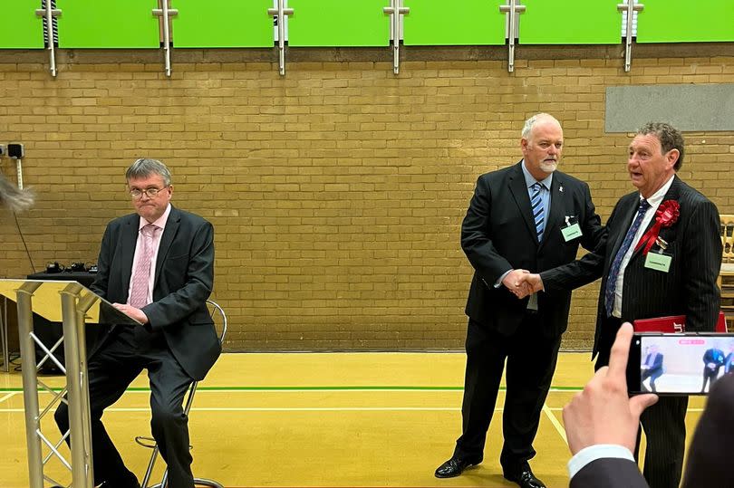 Labour's Simon O'Rourke shakes hands with re-elected Humberside Police and Crime Commissioner Conservative Jonathan Evison