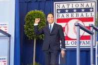 Jul 24, 2016; Cooperstown, NY, USA; Hall of Fame Inductee Mike Piazza waves after being introduced during the 2016 MLB baseball hall of fame induction ceremony at Clark Sports Center. Mandatory Credit: Gregory J. Fisher-USA TODAY Sports