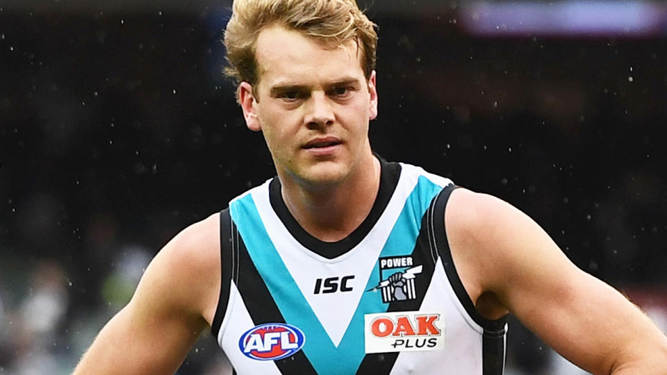 Jack Watts is pictured playing for Port Adelaide in the AFL.