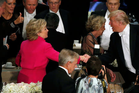 Hillary Clinton and Donald Trump shake hands after their remarks. REUTERS/Jonathan Ernst